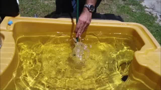 Singing through a garden hose into water Singing through a garden hose into water